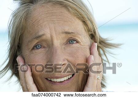 Senior woman with head in hands View Large Photo Image Stock Image - Senior woman with head in hands. Fotosearch