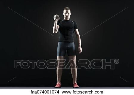Shot putter holding shot View Large Photo Image Picture - Shot putter holding shot. Fotosearch