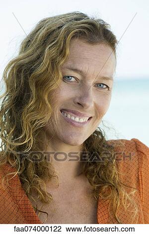 Stock Image - Smiling mature woman, portrait. Fotosearch