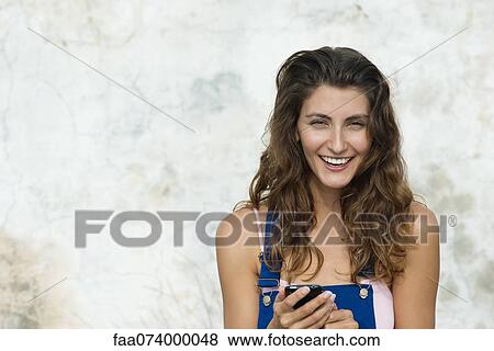 Smiling young woman, portrait View Large Photo Image Stock Photo - Smiling young woman, portrait. Fotosearch