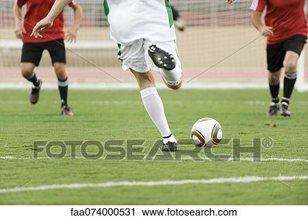 Soccer players on field, cropped View Large Photo Image Stock Image - Soccer players on field, cropped. Fotosearch