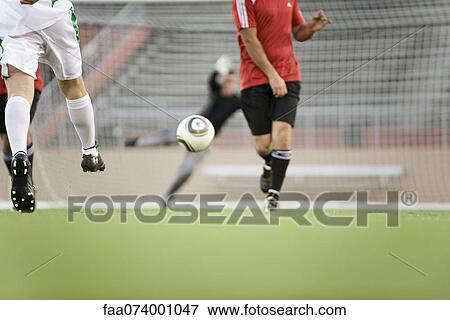 Soccer players on field, cropped View Large Photo Image Stock Photo - Soccer players on field, cropped. Fotosearch