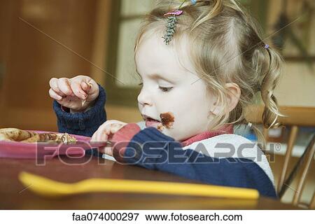 Toddler playing with food View Large Photo Image Stock Photo - Toddler playing with food. Fotosearch
