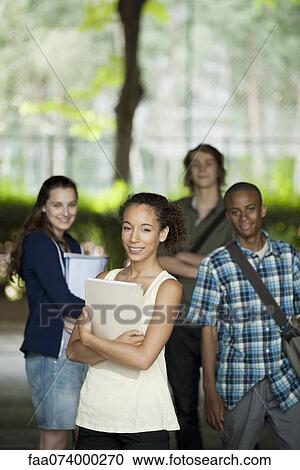 University students, focus on woman in foreground View Large Photo Image Stock Image - University students, focus on woman in foreground. Fotosearch