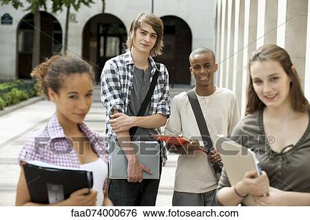 University students on campus, focus on man in background View Large Photo Image Stock Photograph - University students on campus, focus on man in background. Fotosearch