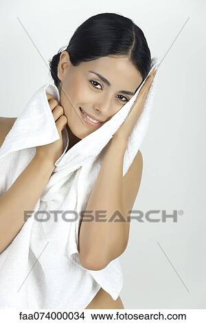 Woman drying off with towel, portrait View Large Photo Image Picture - Woman drying off with towel, portrait. Fotosearch
