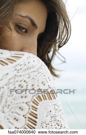 Woman glancing over shoulder View Large Photo Image Stock Image - Woman glancing over shoulder. Fotosearch