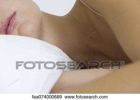 Woman lying on side, cropped View Large Photo Image Stock Photo - Woman lying on side, cropped. Fotosearch