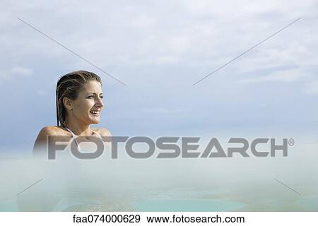 Woman relaxing in water View Large Photo Image Stock Photo - Woman relaxing in water. Fotosearch