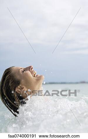 Stock Image - Woman swimming. Fotosearch
