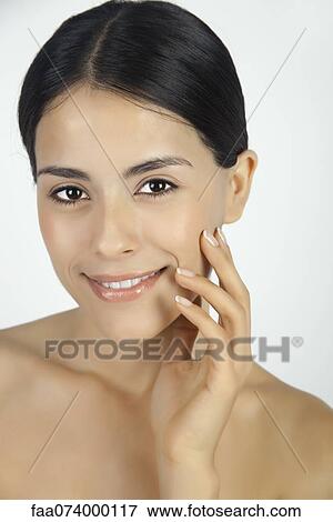 Stock Photo - Woman touching face, portrait. Fotosearch