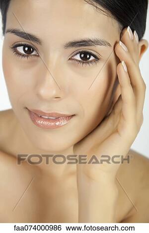 Woman touching face, portrait View Large Photo Image Stock Photograph - Woman touching face, portrait. Fotosearch