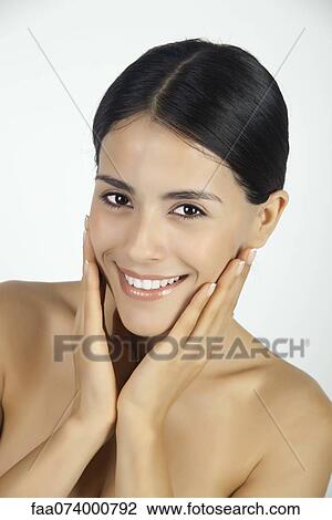 Woman with hands on cheeks, portrait View Large Photo Image Stock Image - Woman with hands on cheeks, portrait. Fotosearch