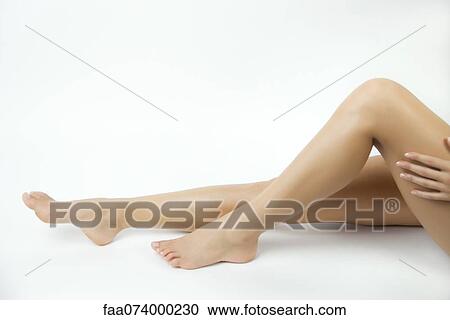 Stock Image - Woman's bare legs. Fotosearch