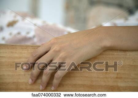Woman's hand resting on table View Large Photo Image Stock Image - Woman's hand resting on table. Fotosearch