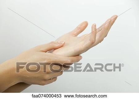 Stock Image - Woman's wet hands. Fotosearch