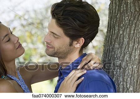 Young couple gazing at each other View Large Photo Image Stock Photo - Young couple gazing at each other. Fotosearch