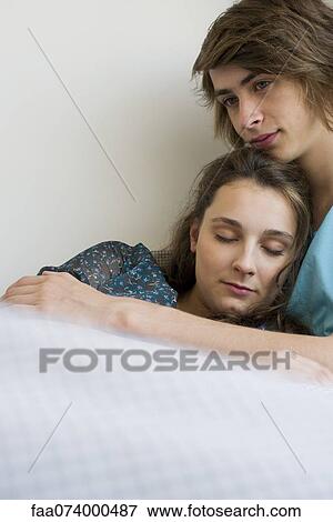 Stock Photo - Young couple relaxing together. Fotosearch