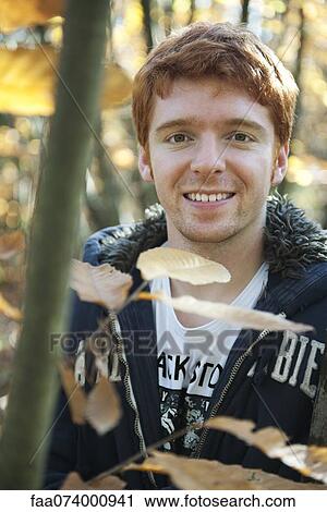 Young man in nature View Large Photo Image Stock Image - Young man in nature. Fotosearch