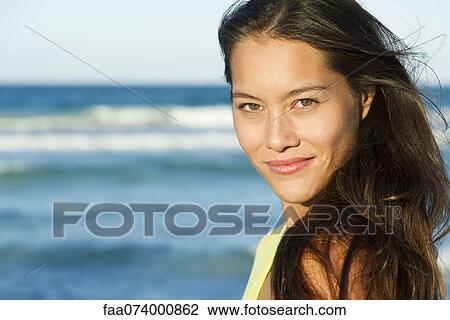 Young woman by sea, portrait View Large Photo Image Stock Image - Young woman by sea, portrait. Fotosearch