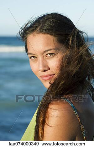 Young woman by sea, portrait View Large Photo Image Stock Photo - Young woman by sea, portrait. Fotosearch
