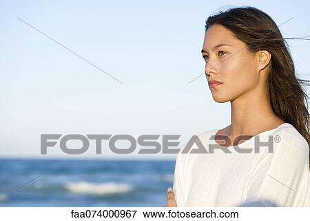 Young woman contemplating over ocean view, portrait View Large Photo Image Stock Photo - Young woman contemplating over ocean view, portrait. Fotosearch