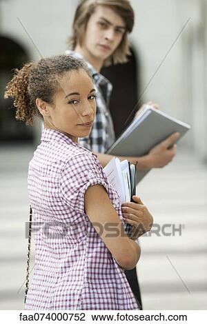 Young woman on university campus View Large Photo Image Stock Image - Young woman on university campus. Fotosearch