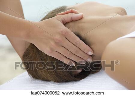 Young woman receiving head massage View Large Photo Image Stock Image - Young woman receiving head massage. Fotosearch