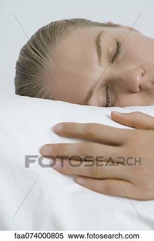 Stock Photography - Young woman sleeping, cropped. Fotosearch