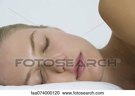 Young woman sleeping on side, cropped View Large Photo Image Stock Image - Young woman sleeping on side, cropped. Fotosearch