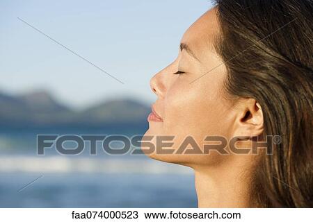 Young woman with eyes closed, profile View Large Photo Image Stock Image - Young woman with eyes closed, profile. Fotosearch