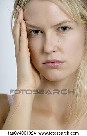 Picture - Young woman with frustration expression, portrait. Fotosearch