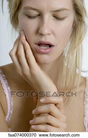 Young woman with toothache View Large Photo Image Stock Image - Young woman with toothache. Fotosearch