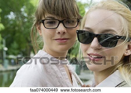 Stock Photo - Young women outdoors, portrait. Fotosearch