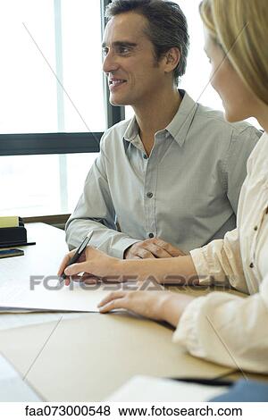 Stock Photo - Associates in meeting. Fotosearch