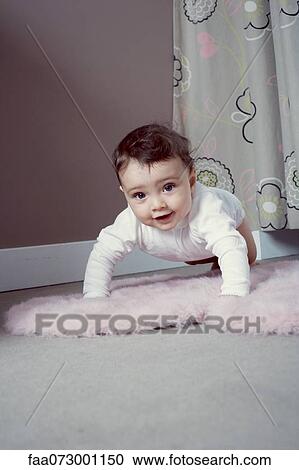 Baby crawling on floor View Large Photo Image Stock Image - Baby crawling on floor. Fotosearch