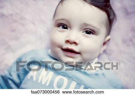 Stock Photograph - Baby girl, portrait. Fotosearch