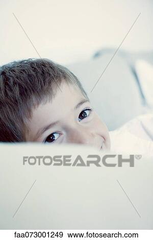 Boy peeking at camera, portrait View Large Photo Image Stock Photo - Boy peeking at camera, portrait. Fotosearch