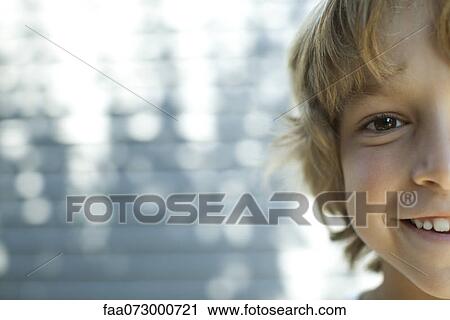 Boy smiling at camera, cropped portrait View Large Photo Image Stock Image - Boy smiling at camera, cropped portrait. Fotosearch