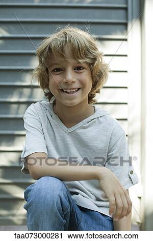 Boy smiling at camera, portrait View Large Photo Image Stock Image - Boy smiling at camera, portrait. Fotosearch