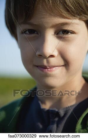 Stock Photo - Boy smiling, portrait. Fotosearch