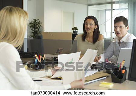 Business associates meeting in office View Large Photo Image Picture - Business associates meeting in office. Fotosearch