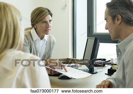 Businesswoman discussing contract with clients View Large Photo Image Stock Photo - Businesswoman discussing contract with clients. Fotosearch