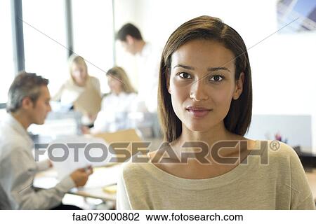 Stock Image - Businesswoman in office, portrait. Fotosearch