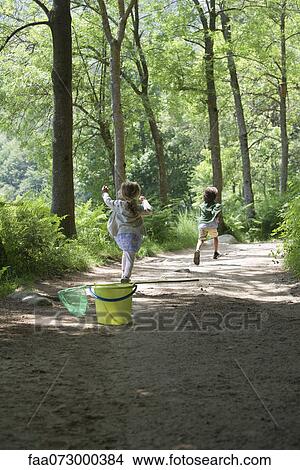 Children running on path through woods View Large Photo Image Picture - Children running on path through woods. Fotosearch