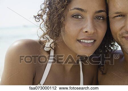 Stock Image - Couple at the beach, cropped portrait. Fotosearch