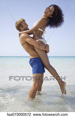 Couple at the beach View Large Photo Image Stock Image - Couple at the beach. Fotosearch