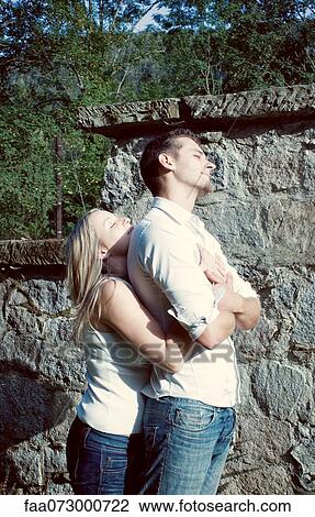 Couple embracing outdoors View Large Photo Image Stock Image - Couple embracing outdoors. Fotosearch