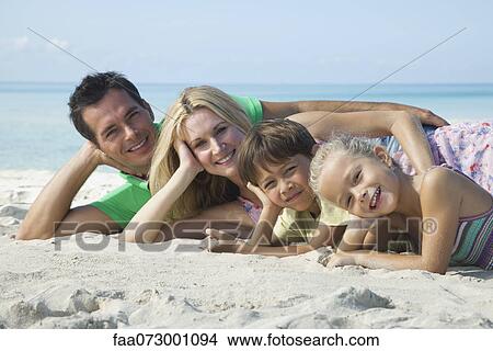 Family posing together at the beach, portrait View Large Photo Image Picture - Family posing together at the beach, portrait. Fotosearch