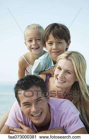 Family posing together at the beach, portrait View Large Photo Image Stock Image - Family posing together at the beach, portrait. Fotosearch